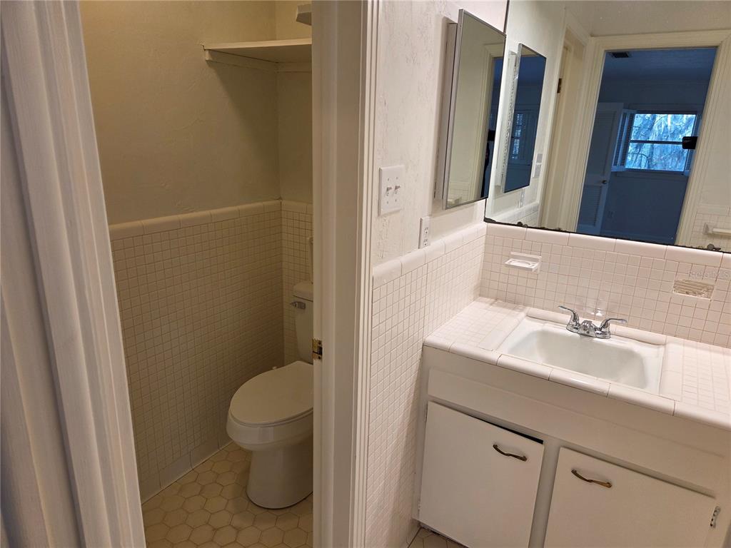 2901 Southwest 4 Court Gainesville, FL 32601 - Photo 50 of 58 a bathroom with a sink a toilet and shower