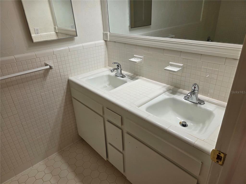 2901 Southwest 4 Court Gainesville, FL 32601 - Photo 55 of 58 a bathroom with a sink and a mirror