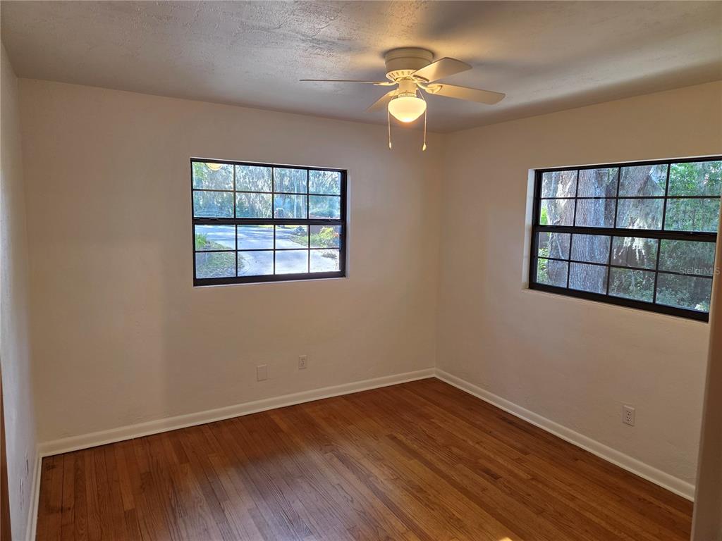 2901 Southwest 4 Court Gainesville, FL 32601 - Photo 58 of 58 an empty room with wooden floor and windows