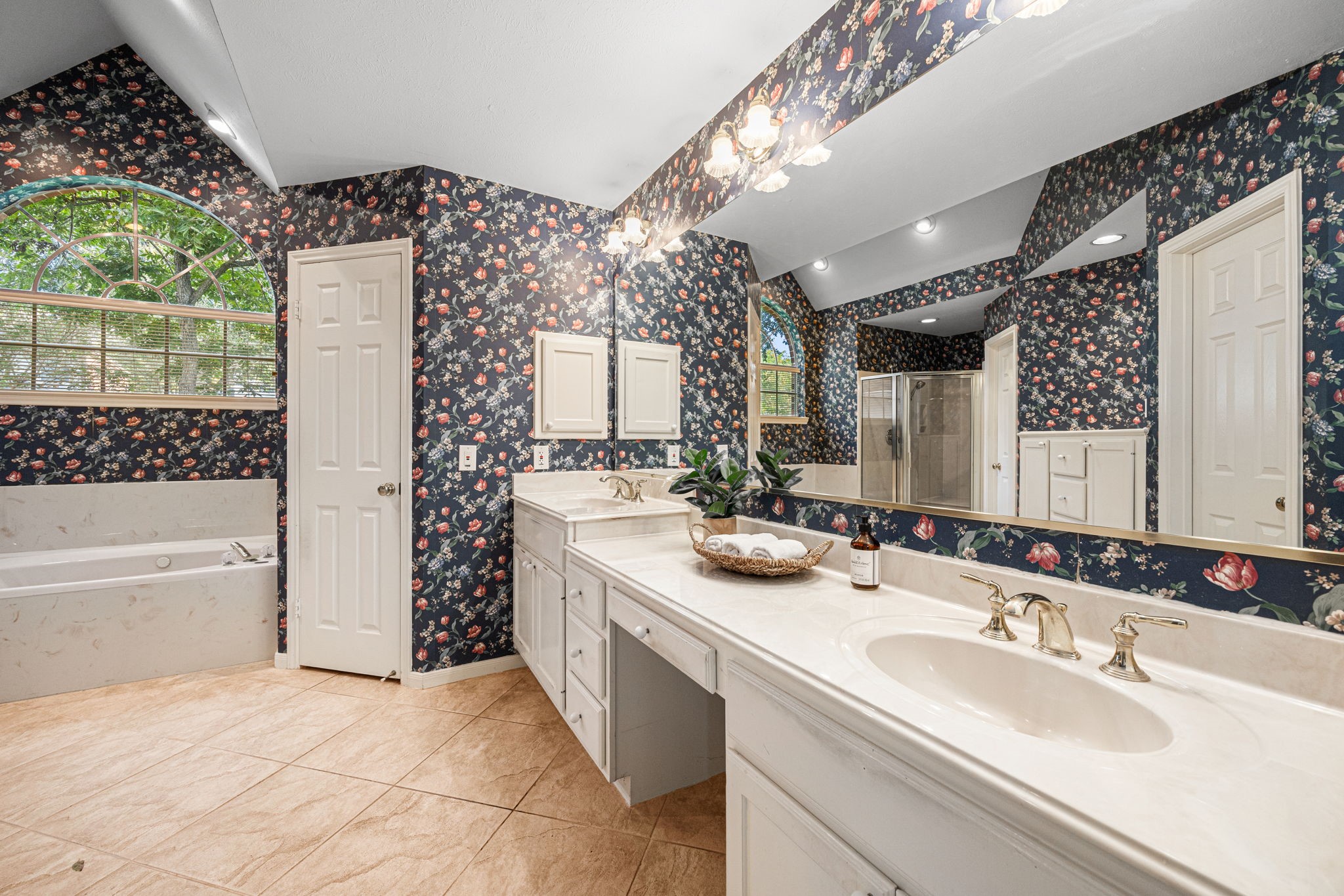 1102 Wood Fern Drive Sugar Land, TX 77479 - Photo 12 of 43 a bathroom with a tub sink and mirror