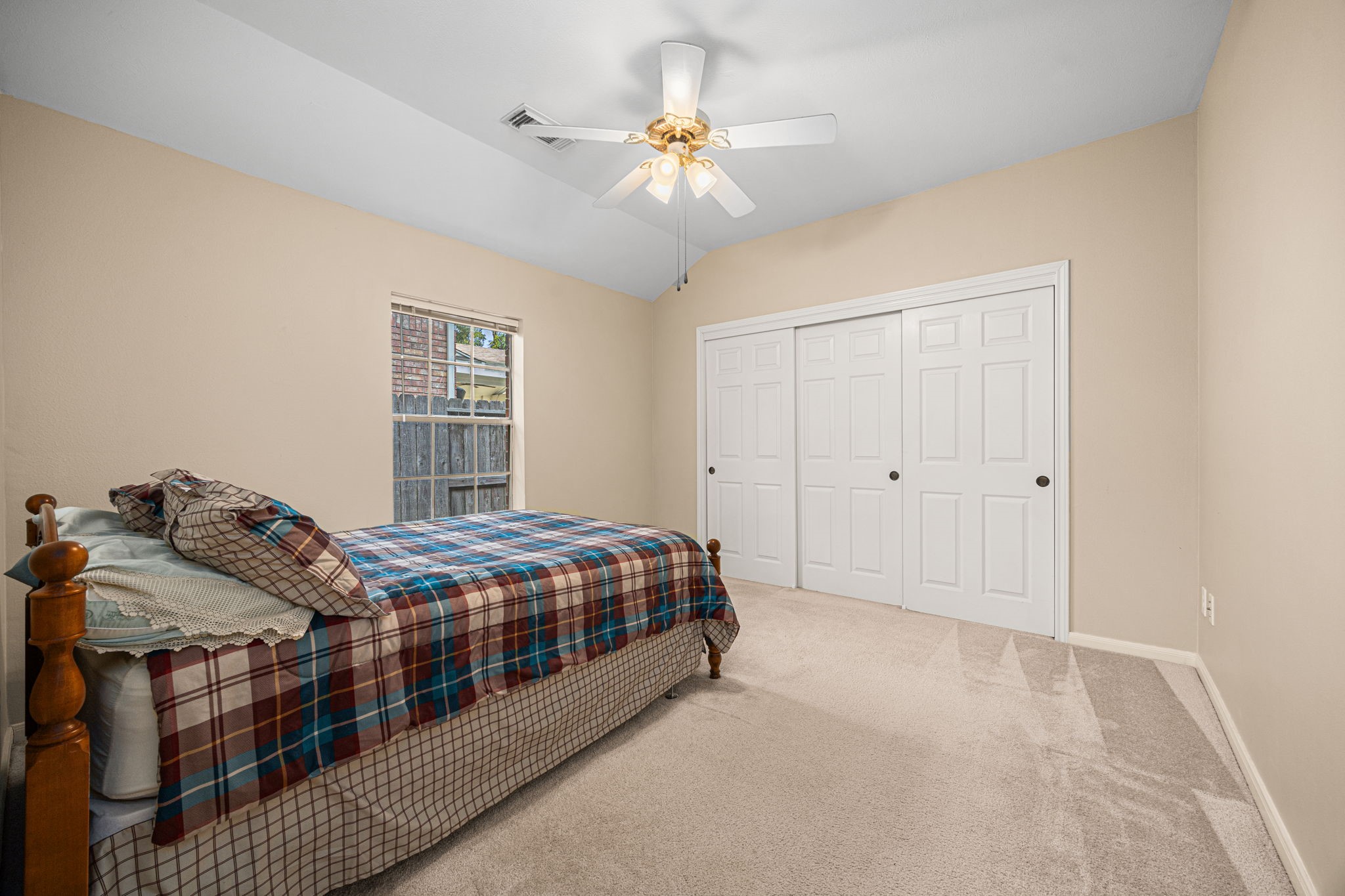 1102 Wood Fern Drive Sugar Land, TX 77479 - Photo 19 of 43 a bedroom with a bed and a chandelier