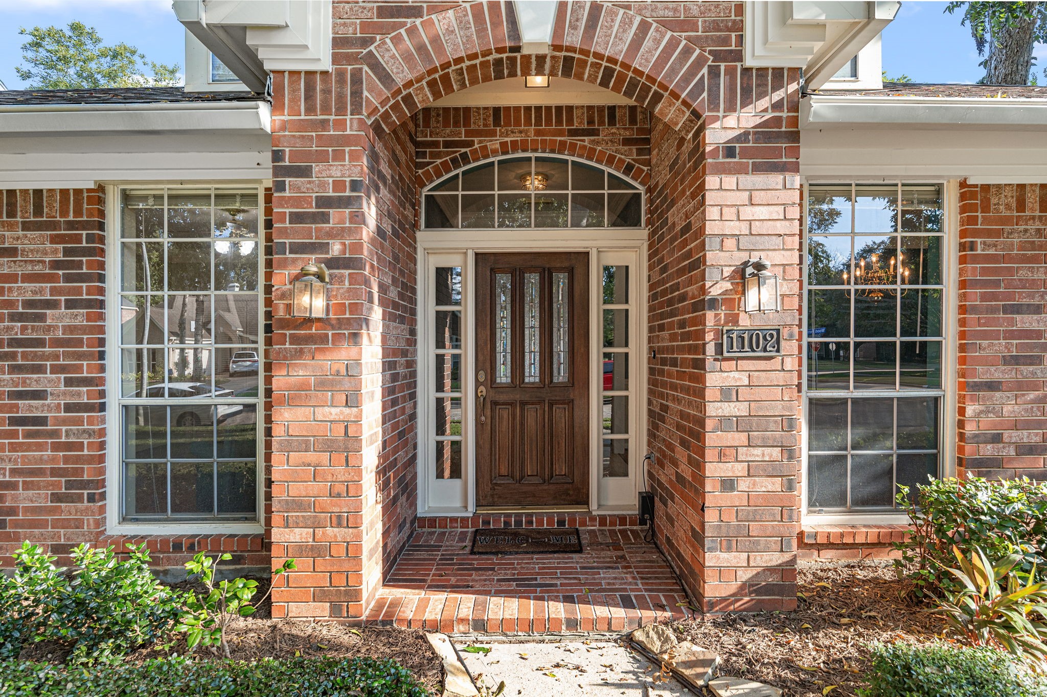 1102 Wood Fern Drive Sugar Land, TX 77479 - Photo 3 of 43 a front view of a house with a yard