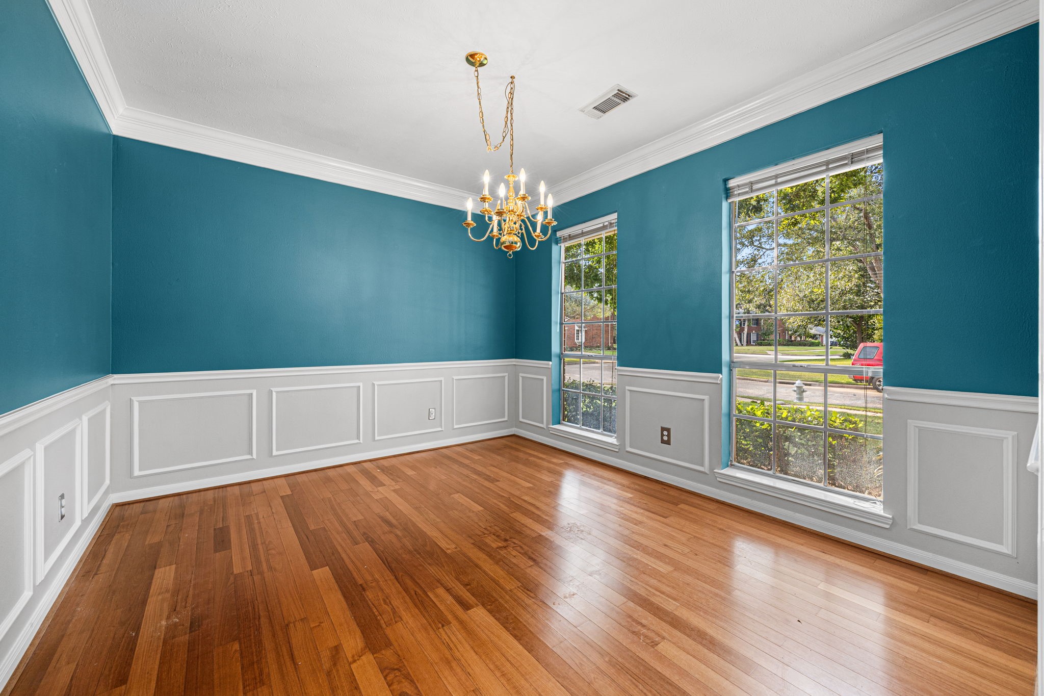 1102 Wood Fern Drive Sugar Land, TX 77479 - Photo 4 of 43 a view of an empty room with window and wooden floor