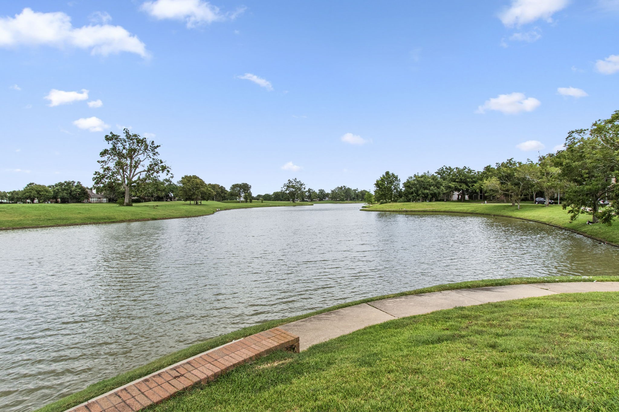 1102 Wood Fern Drive Sugar Land, TX 77479 - Photo 41 of 43 a view of a lake with a big yard
