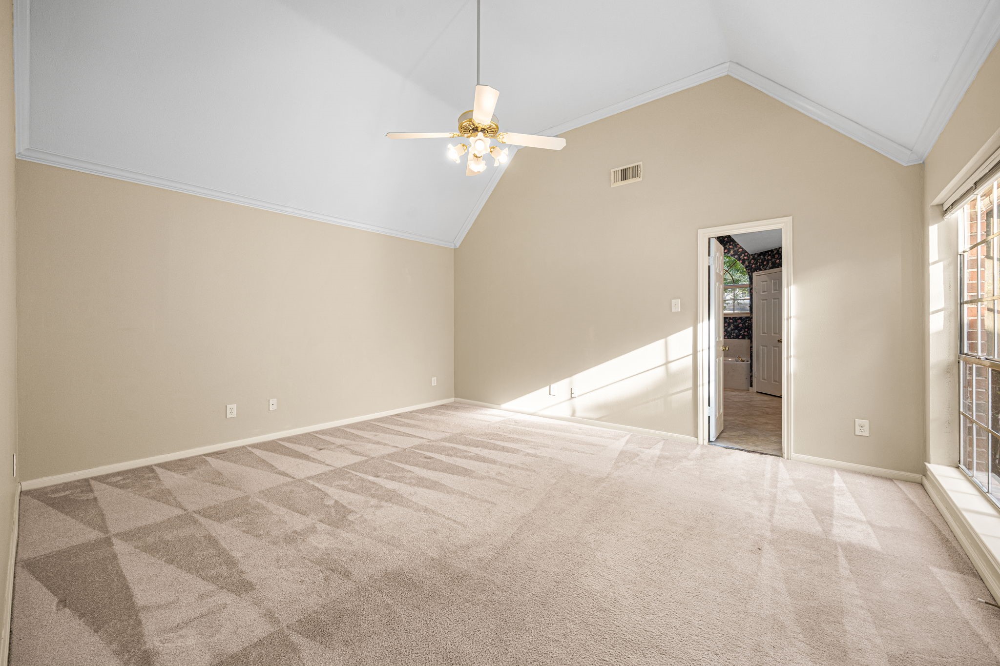 1102 Wood Fern Drive Sugar Land, TX 77479 - Photo 10 of 43 a view of an empty room with window and chandelier fan
