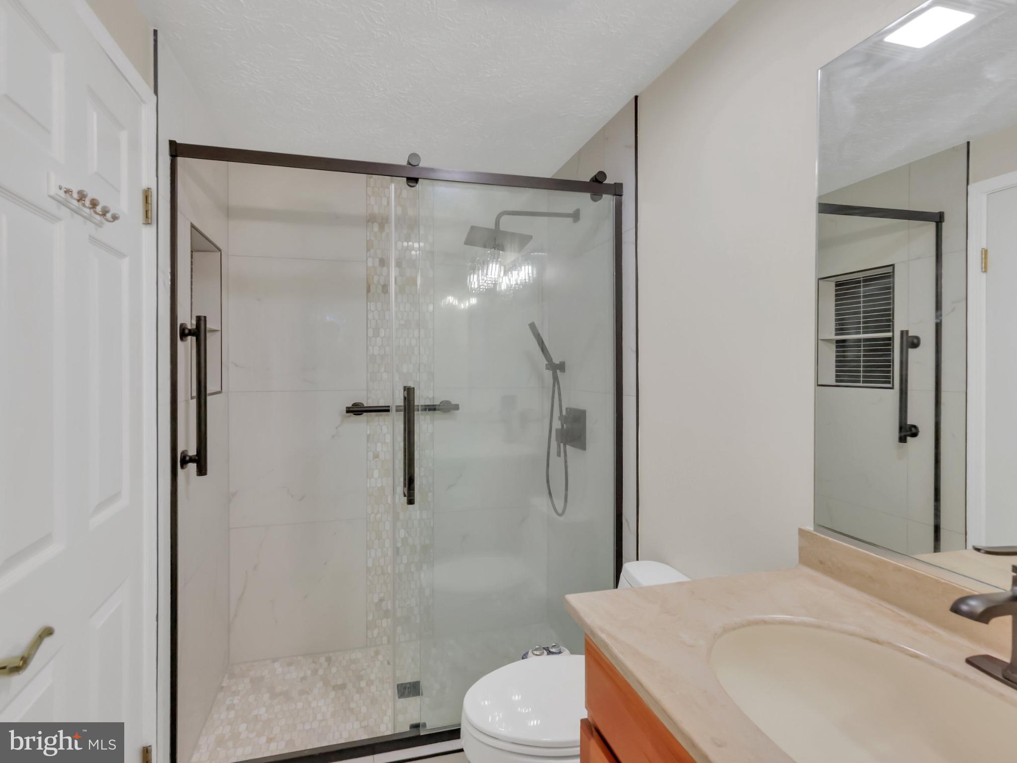 18 Windmill Court Silver Spring, MD 20905 - Photo 29 of 37 Sleek modern bathroom oasis.