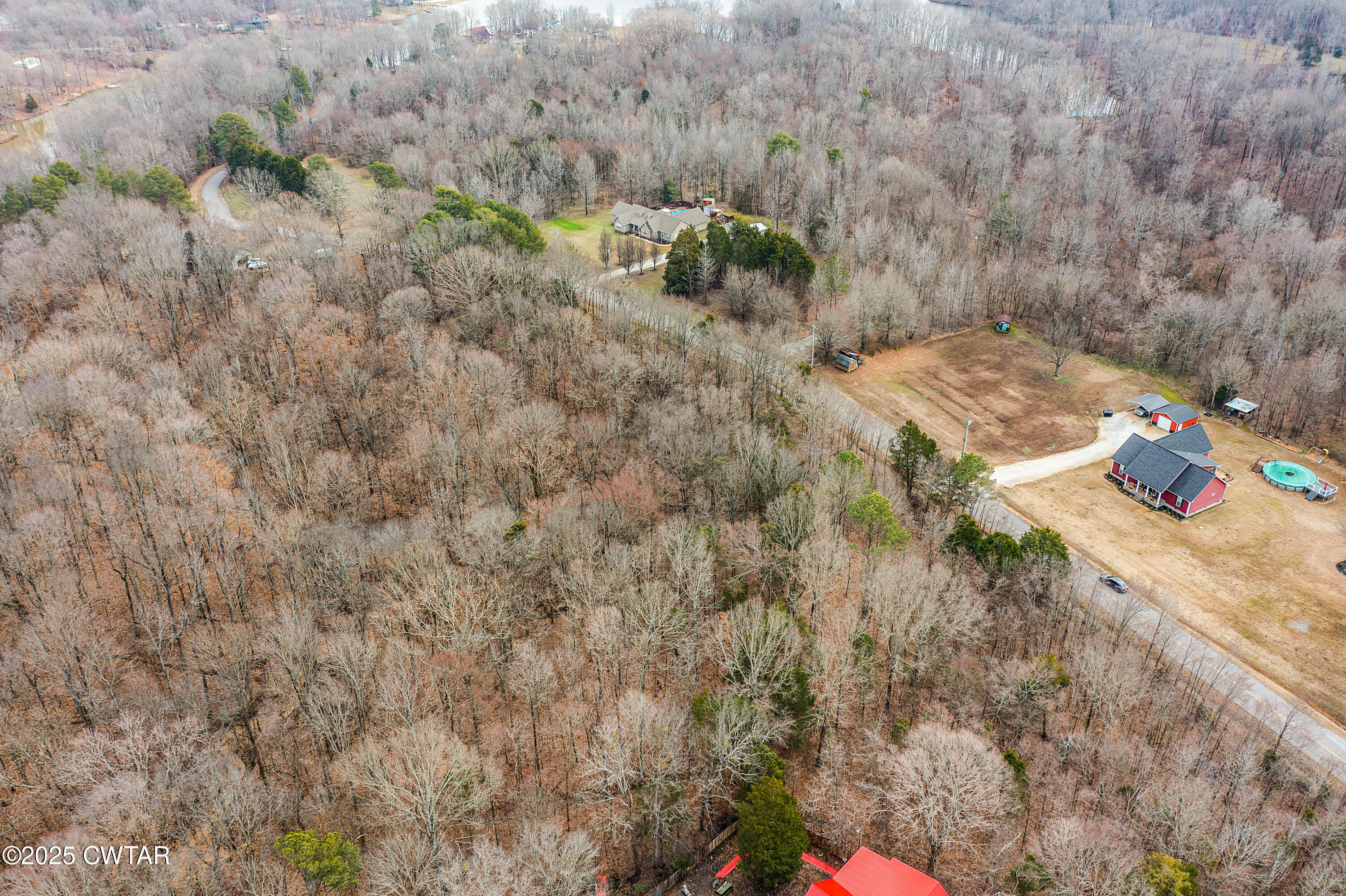 44 Lake Hayes Estates Road Trenton, TN 38382 - Photo 10 of 29 a view of a yard with some trees