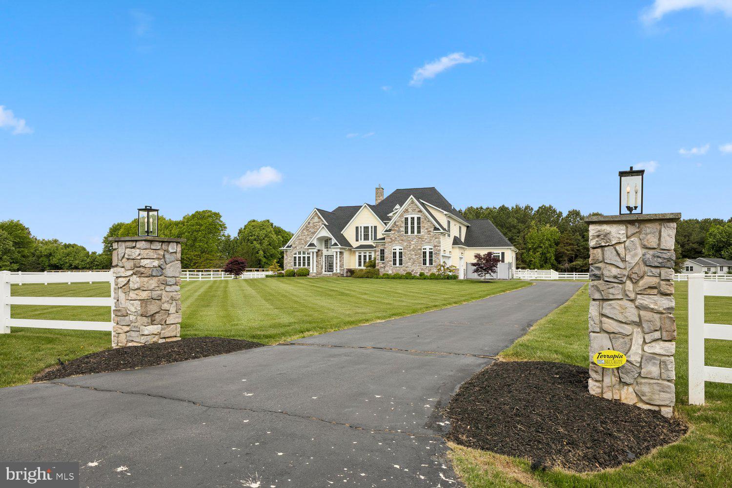 313 Wye Road Queenstown, MD 21658 - Photo 1 of 132 Elegant estate with lush green surroundings.