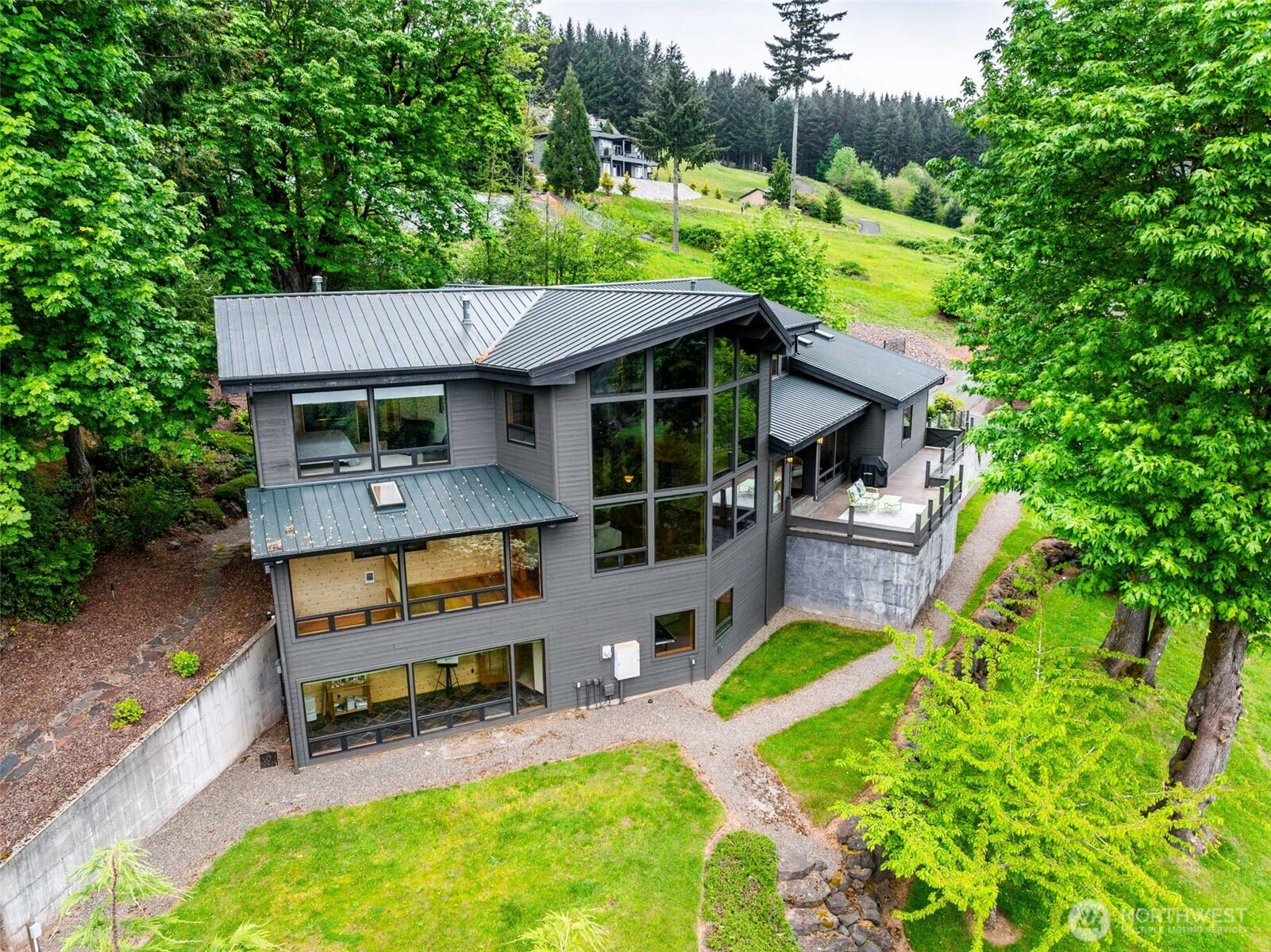 813 Varsity Road Kalama, WA 98625 - Photo 2 of 40 a view of house with backyard outdoor seating and green space
