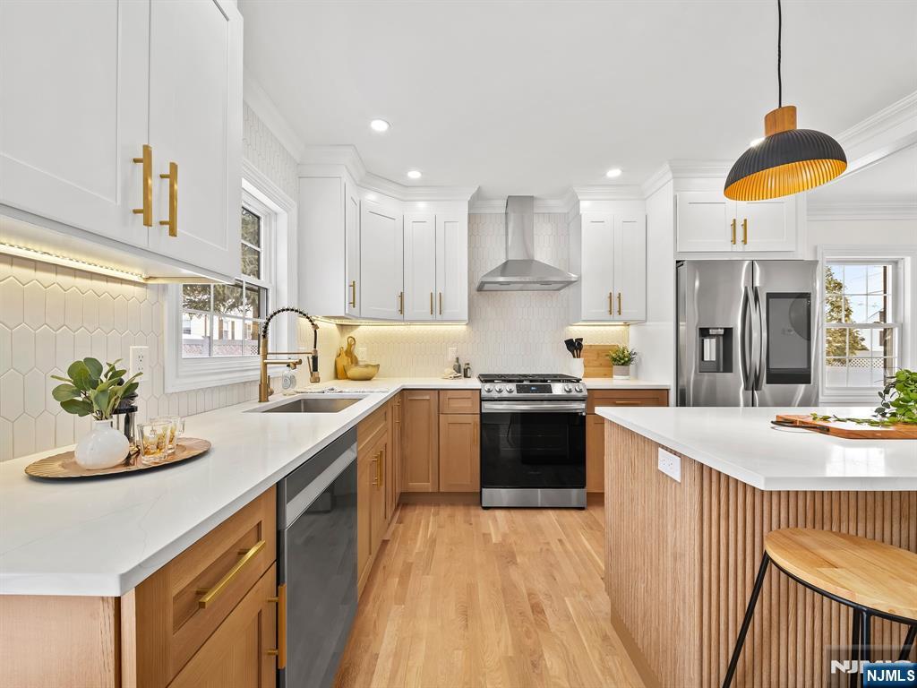 857 Collingwood Avenue Maywood, NJ 07607 - Photo 12 of 30 a kitchen with stainless steel appliances granite countertop a sink a stove and a refrigerator
