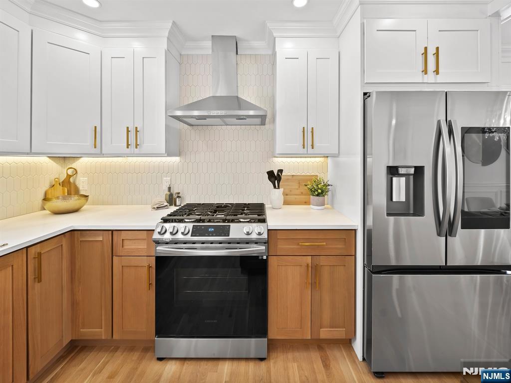 857 Collingwood Avenue Maywood, NJ 07607 - Photo 13 of 30 a kitchen with a stove and a refrigerator