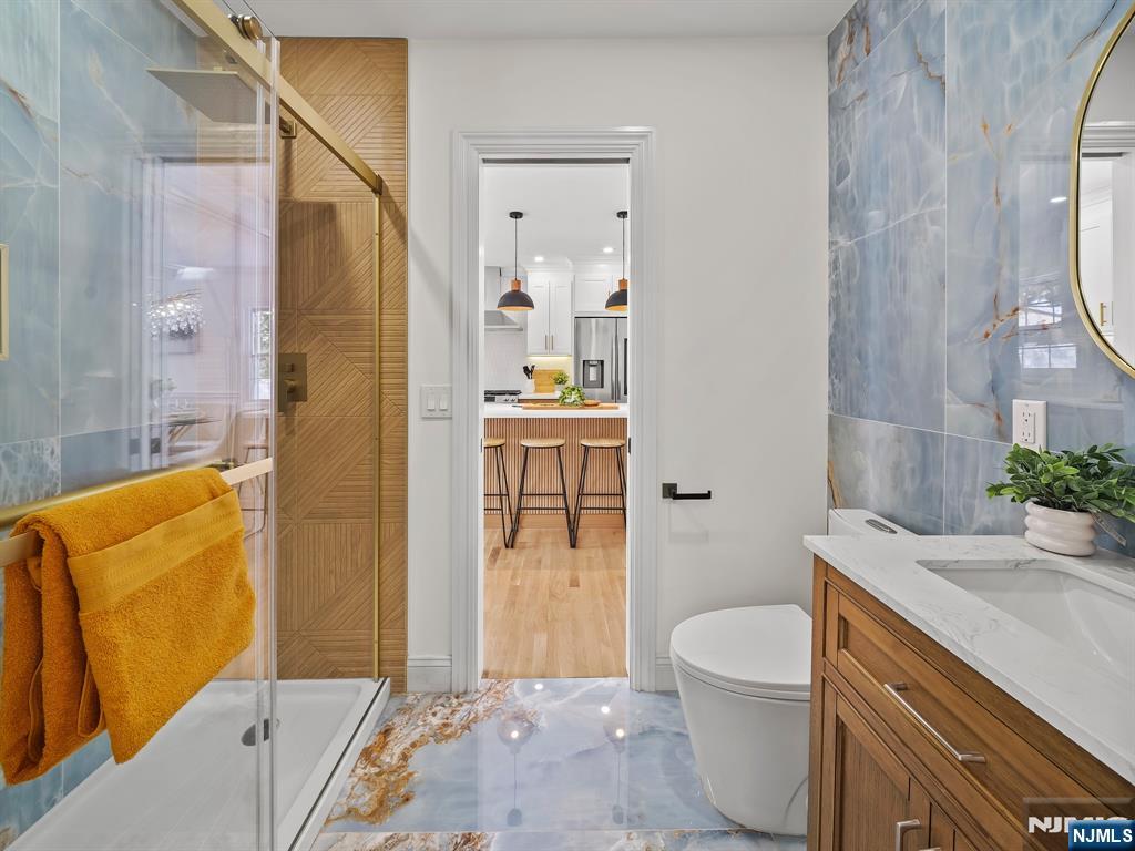 857 Collingwood Avenue Maywood, NJ 07607 - Photo 15 of 30 a bathroom with a sink a toilet and shower