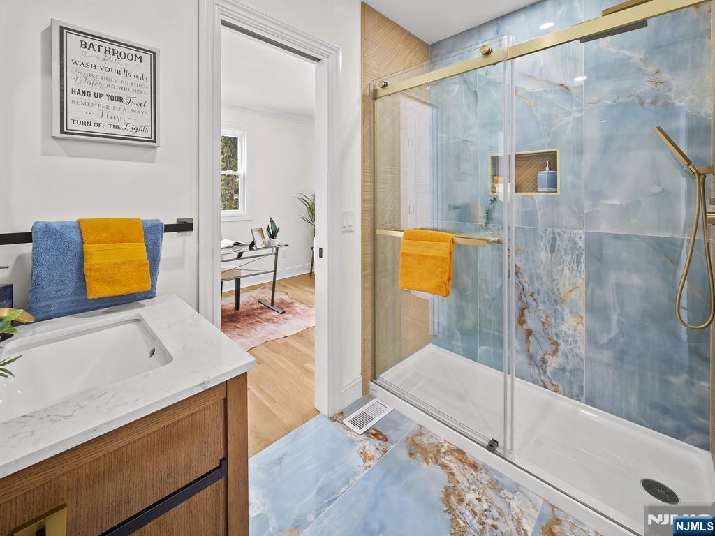 857 Collingwood Avenue Maywood, NJ 07607 - Photo 16 of 30 a bathroom with a tub sink and mirror