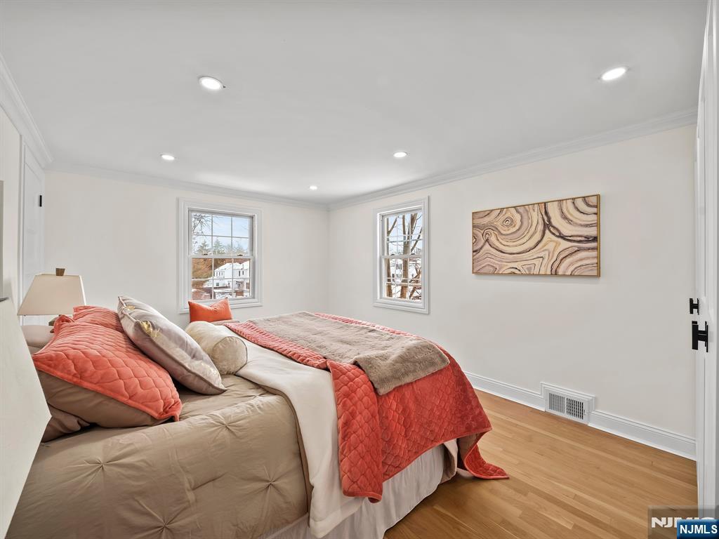 857 Collingwood Avenue Maywood, NJ 07607 - Photo 20 of 30 a bed sitting in a bedroom next to a window