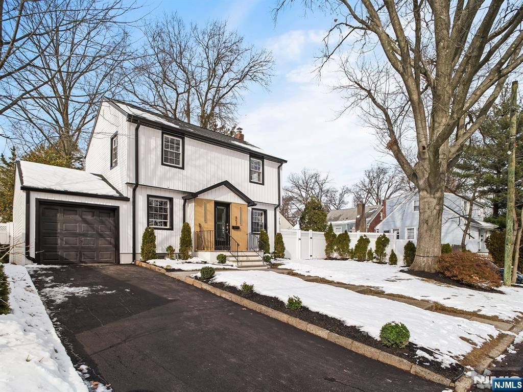 857 Collingwood Avenue Maywood, NJ 07607 - Photo 2 of 30 a front view of a building with large trees