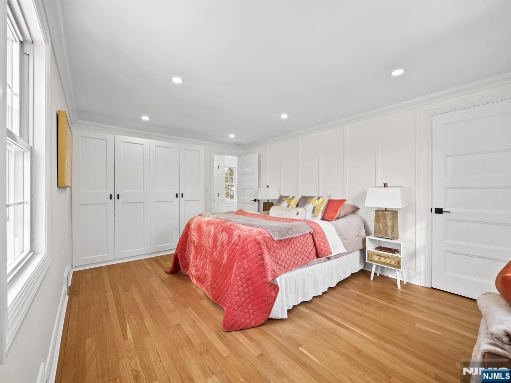 857 Collingwood Avenue Maywood, NJ 07607 - Photo 21 of 30 a spacious bedroom with a bed and a window