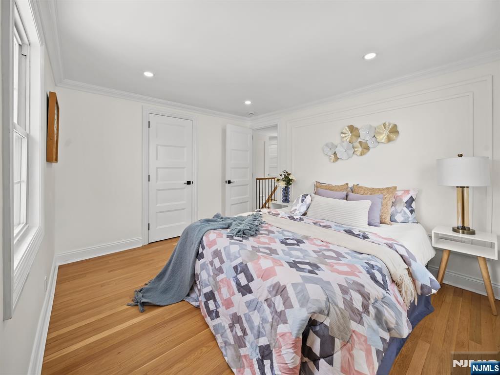 857 Collingwood Avenue Maywood, NJ 07607 - Photo 23 of 30 a bed room with a bed and a lamp