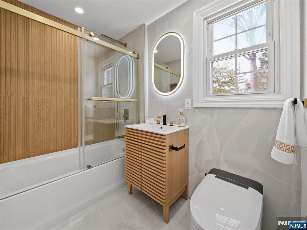 857 Collingwood Avenue Maywood, NJ 07607 - Photo 25 of 30 a bathroom with a sink a toilet and a mirror