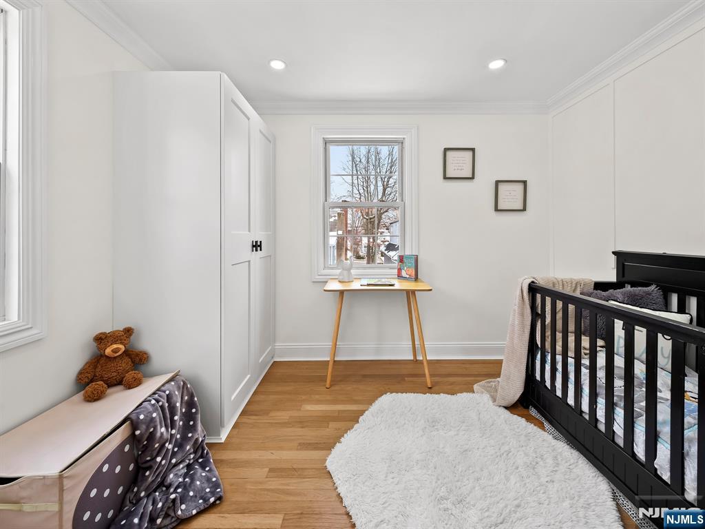857 Collingwood Avenue Maywood, NJ 07607 - Photo 27 of 30 a bedroom with furniture and a window
