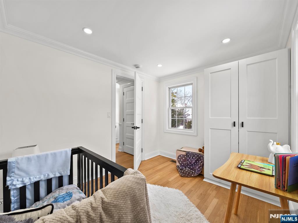 857 Collingwood Avenue Maywood, NJ 07607 - Photo 28 of 30 a bedroom with a bed and a window