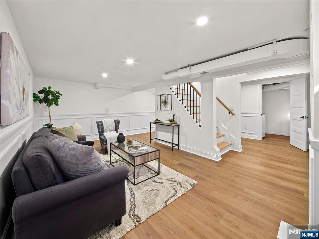 857 Collingwood Avenue Maywood, NJ 07607 - Photo 29 of 30 a living room with furniture and wooden floor