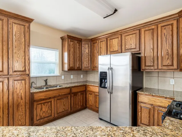 a view of a a dining room with furniture window and wooden floor