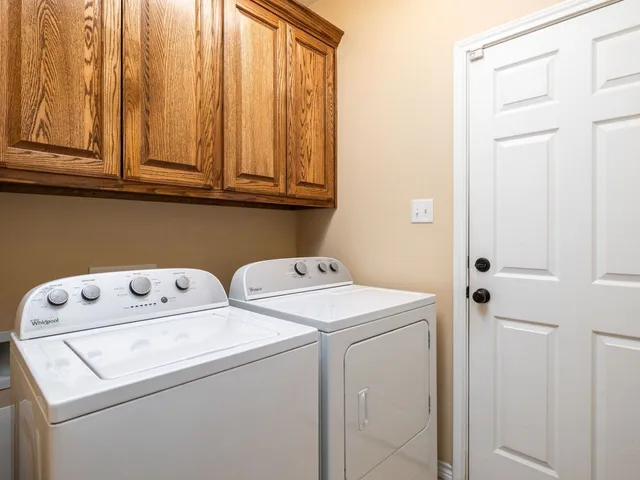 a house view with swimming pool in front of it