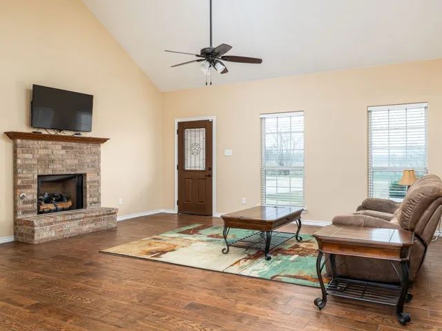 a living room with furniture and a rug
