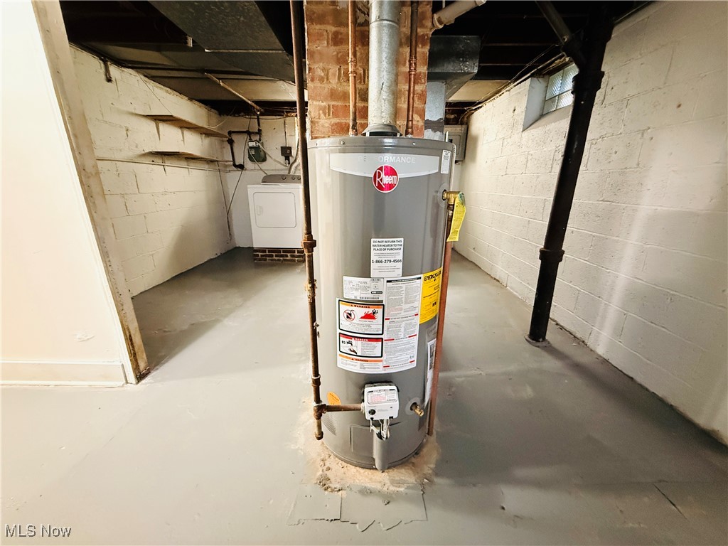 5239 Arch Street Maple Heights, OH 44137 - Photo 20 of 25 Utilities featuring water heater and washer / dryer
