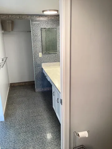 a view of bathroom with bathtub and shower