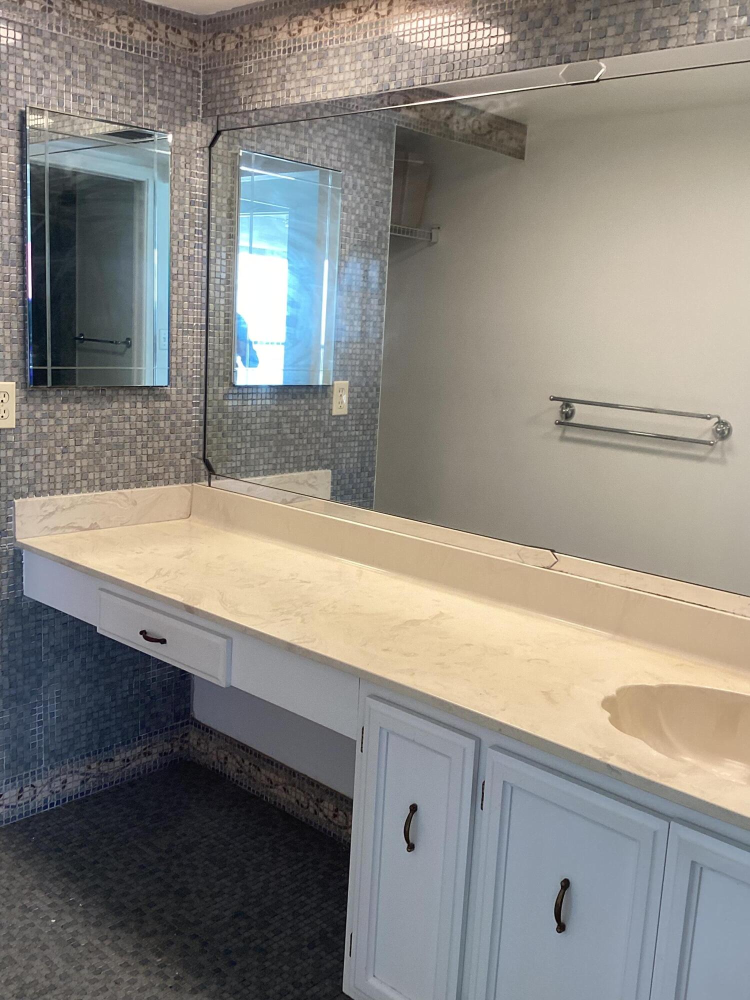 2308 Bridgewood Drive, Unit 2308 Boca Raton, FL 33434 - Photo 26 of 42 a bathroom with a sink and a mirror