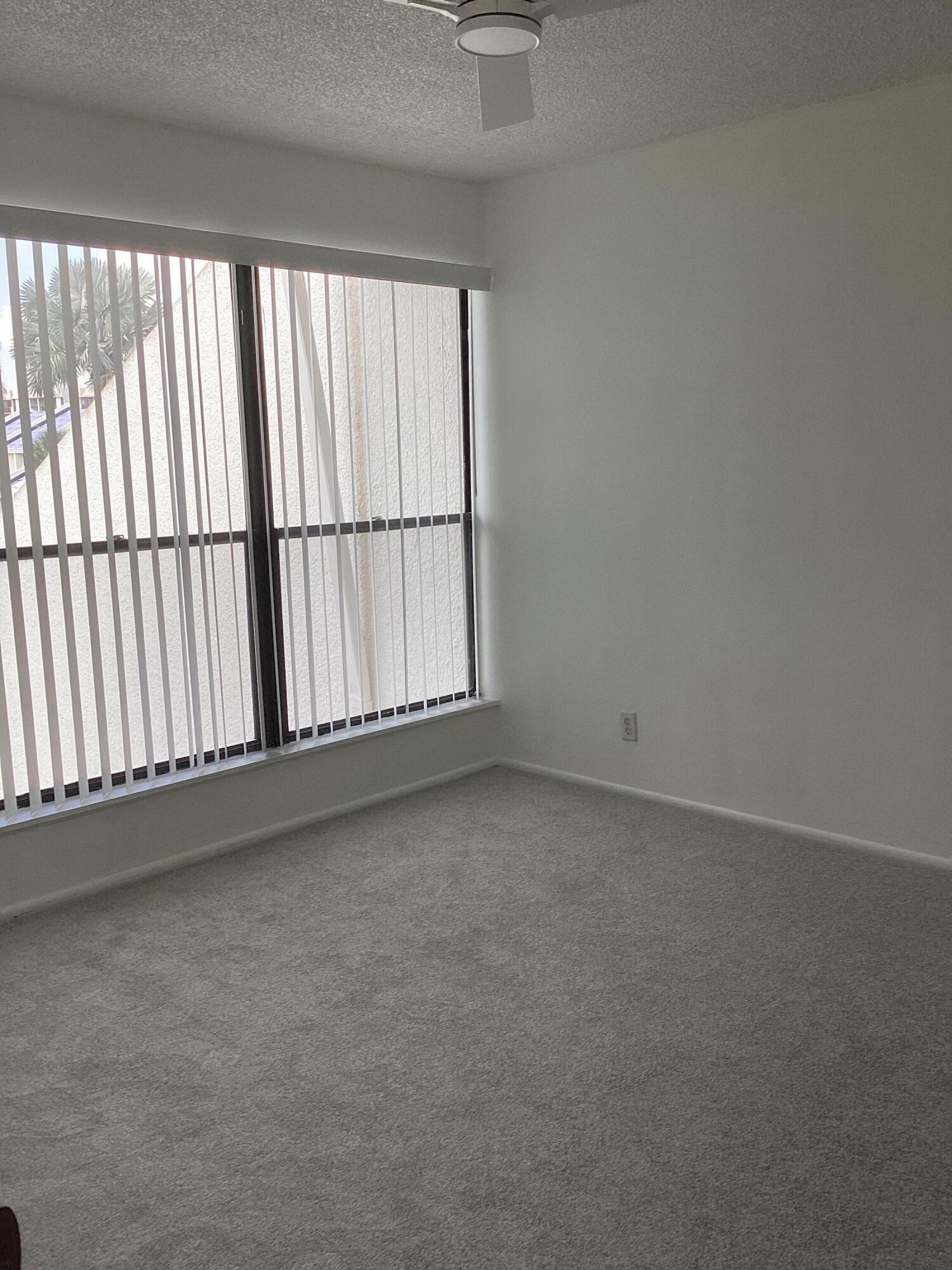 2308 Bridgewood Drive, Unit 2308 Boca Raton, FL 33434 - Photo 28 of 42 a view of an empty room with a window
