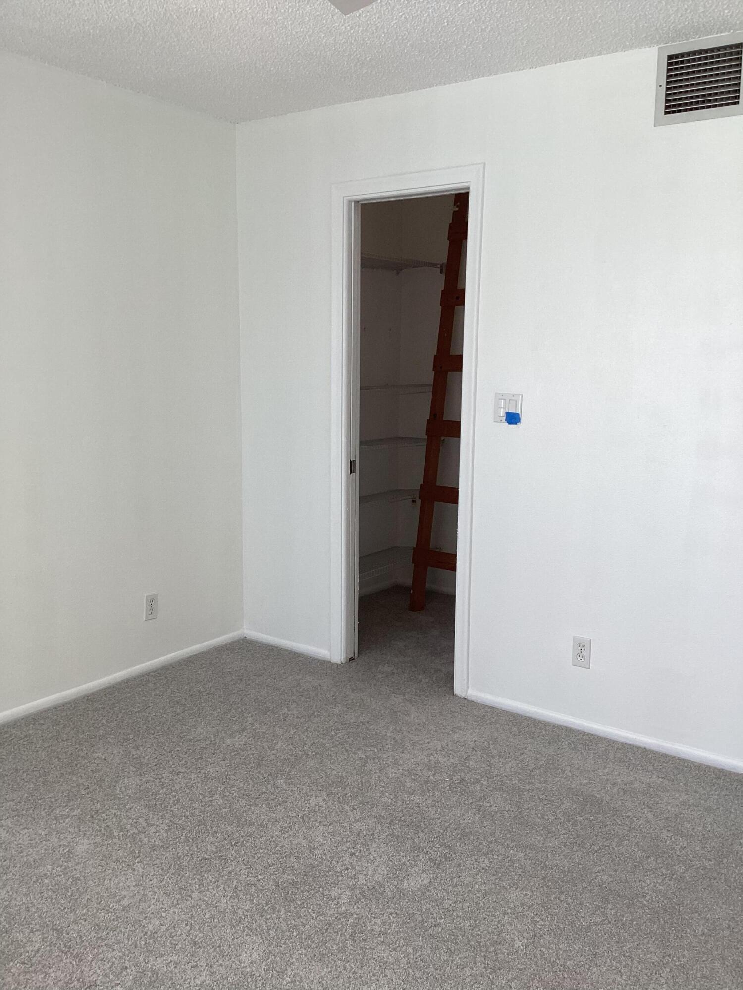 2308 Bridgewood Drive, Unit 2308 Boca Raton, FL 33434 - Photo 29 of 42 a view of an empty room and closet