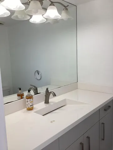 an empty room with wooden floor and closet