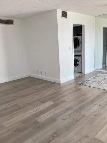 a swimming pool with outdoor seating and garden