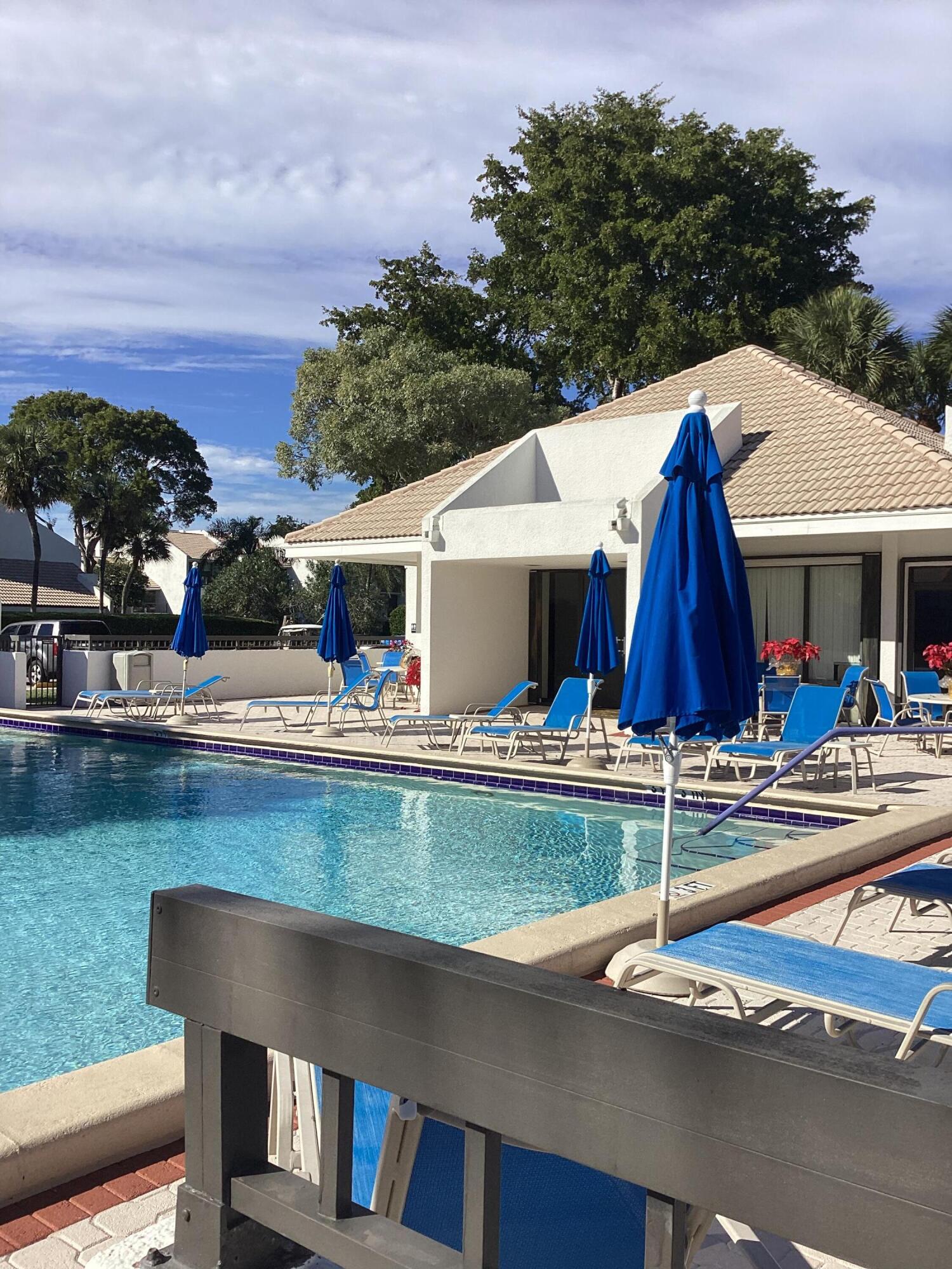 2308 Bridgewood Drive, Unit 2308 Boca Raton, FL 33434 - Photo 36 of 42 a view of house with outdoor space and swimming pool