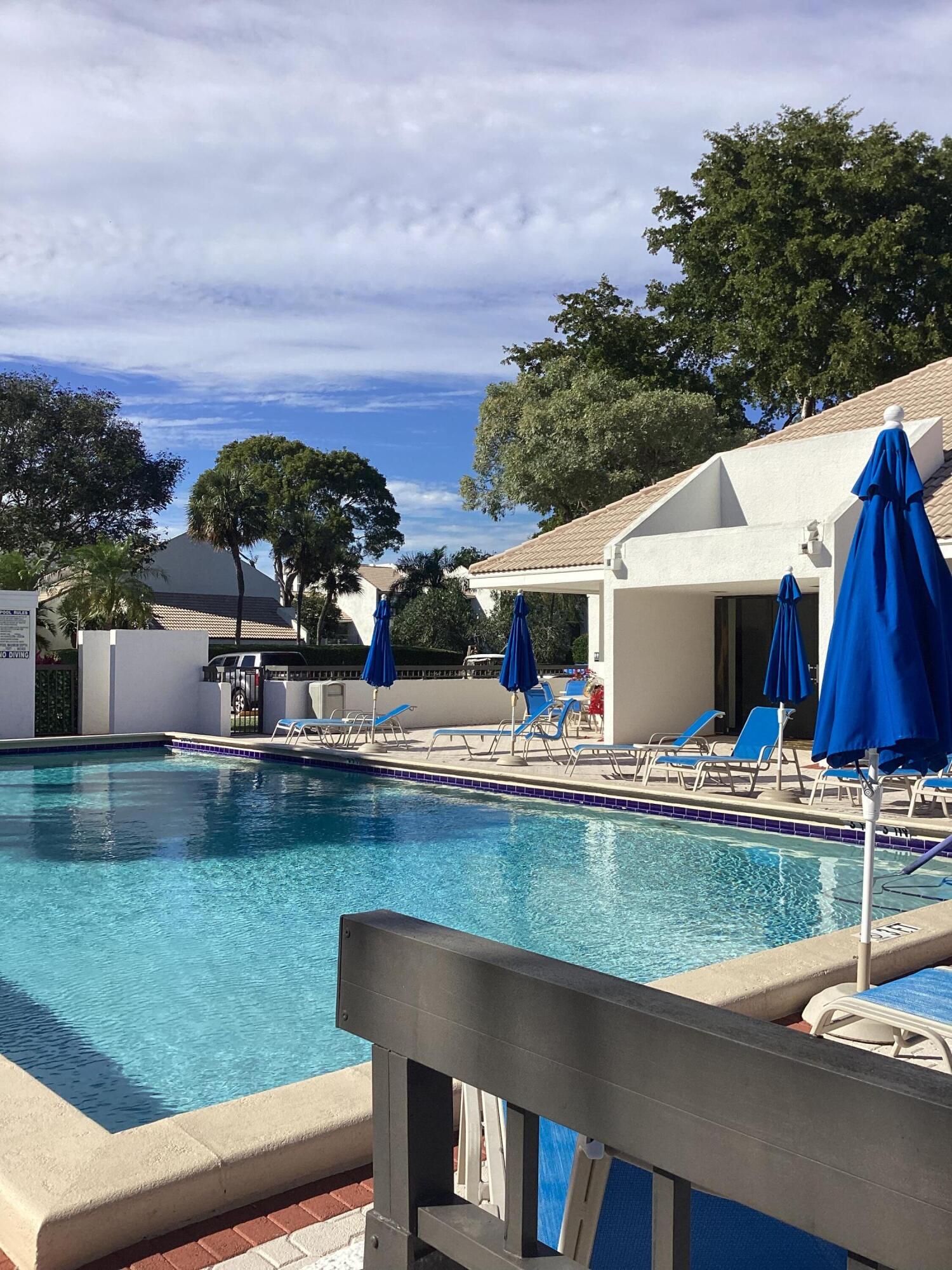 2308 Bridgewood Drive, Unit 2308 Boca Raton, FL 33434 - Photo 37 of 42 a view of a house with swimming pool and sitting area