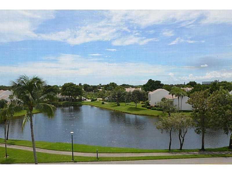 2308 Bridgewood Drive, Unit 2308 Boca Raton, FL 33434 - Photo 38 of 42 a view of a lake with houses