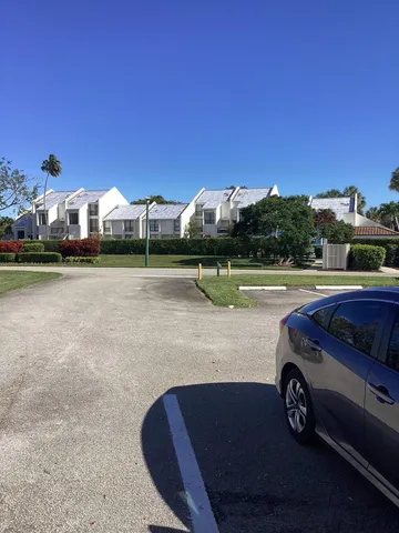 a view of a golf club with a yard