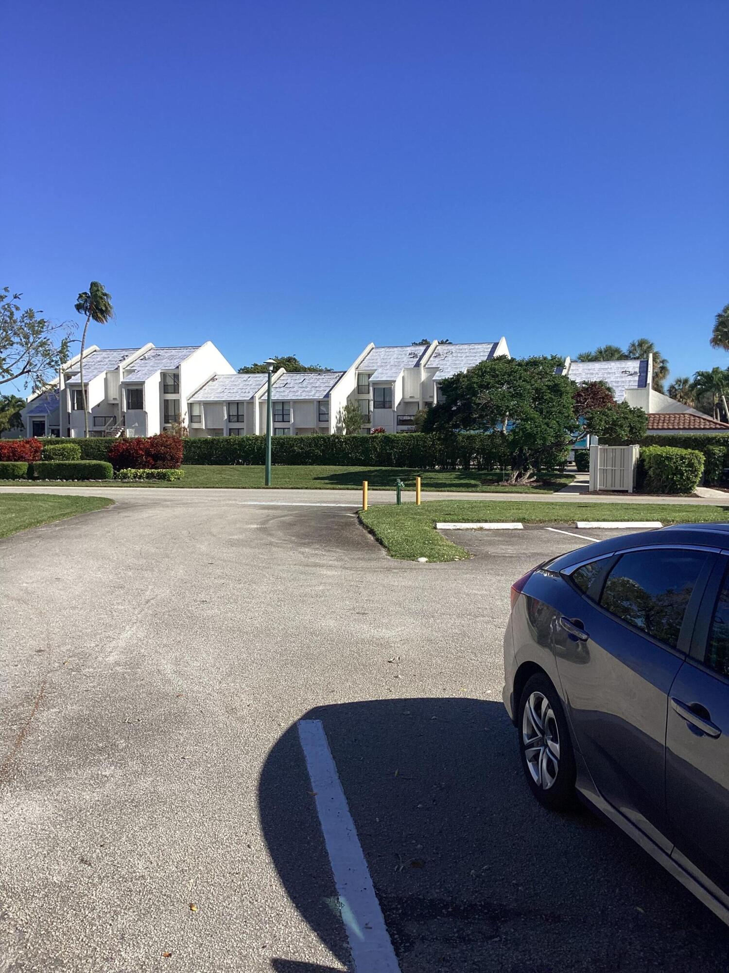 2308 Bridgewood Drive, Unit 2308 Boca Raton, FL 33434 - Photo 39 of 42 a car parked on the side of the river