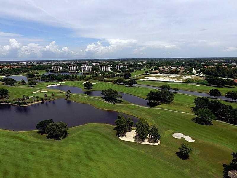 2308 Bridgewood Drive, Unit 2308 Boca Raton, FL 33434 - Photo 40 of 42 a view of a golf club with a yard