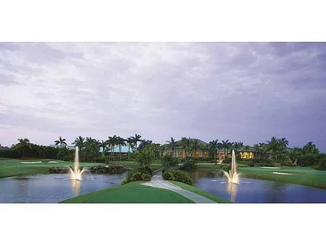 a swimming pool with outdoor seating and garden