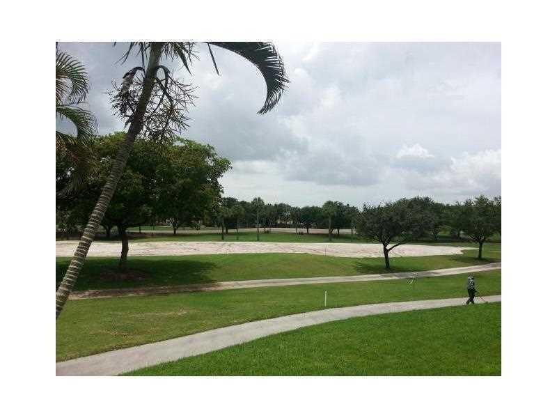 2308 Bridgewood Drive, Unit 2308 Boca Raton, FL 33434 - Photo 42 of 42 a swimming pool with outdoor seating and garden