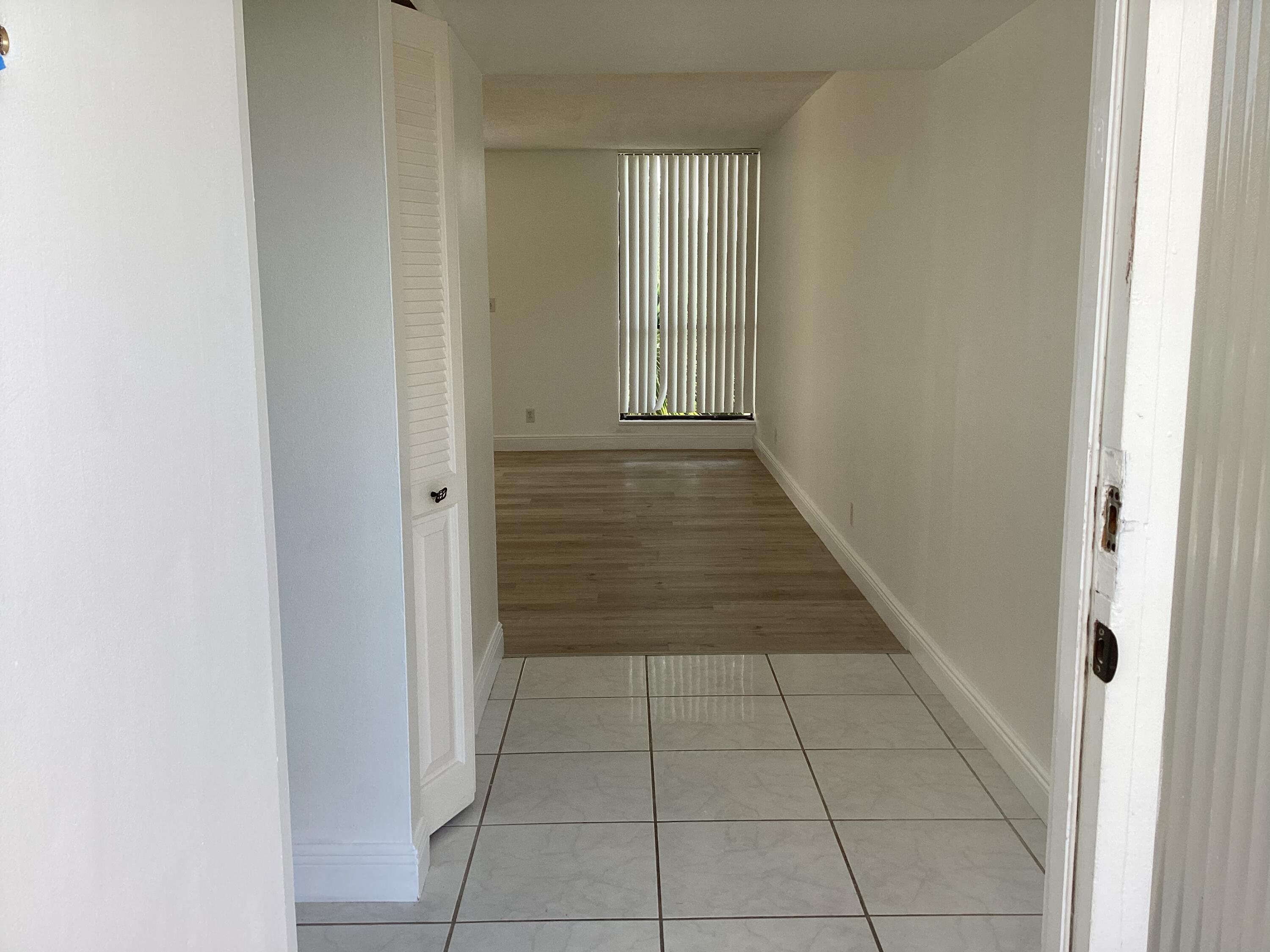 2308 Bridgewood Drive, Unit 2308 Boca Raton, FL 33434 - Photo 5 of 42 a view of a hallway with entryway