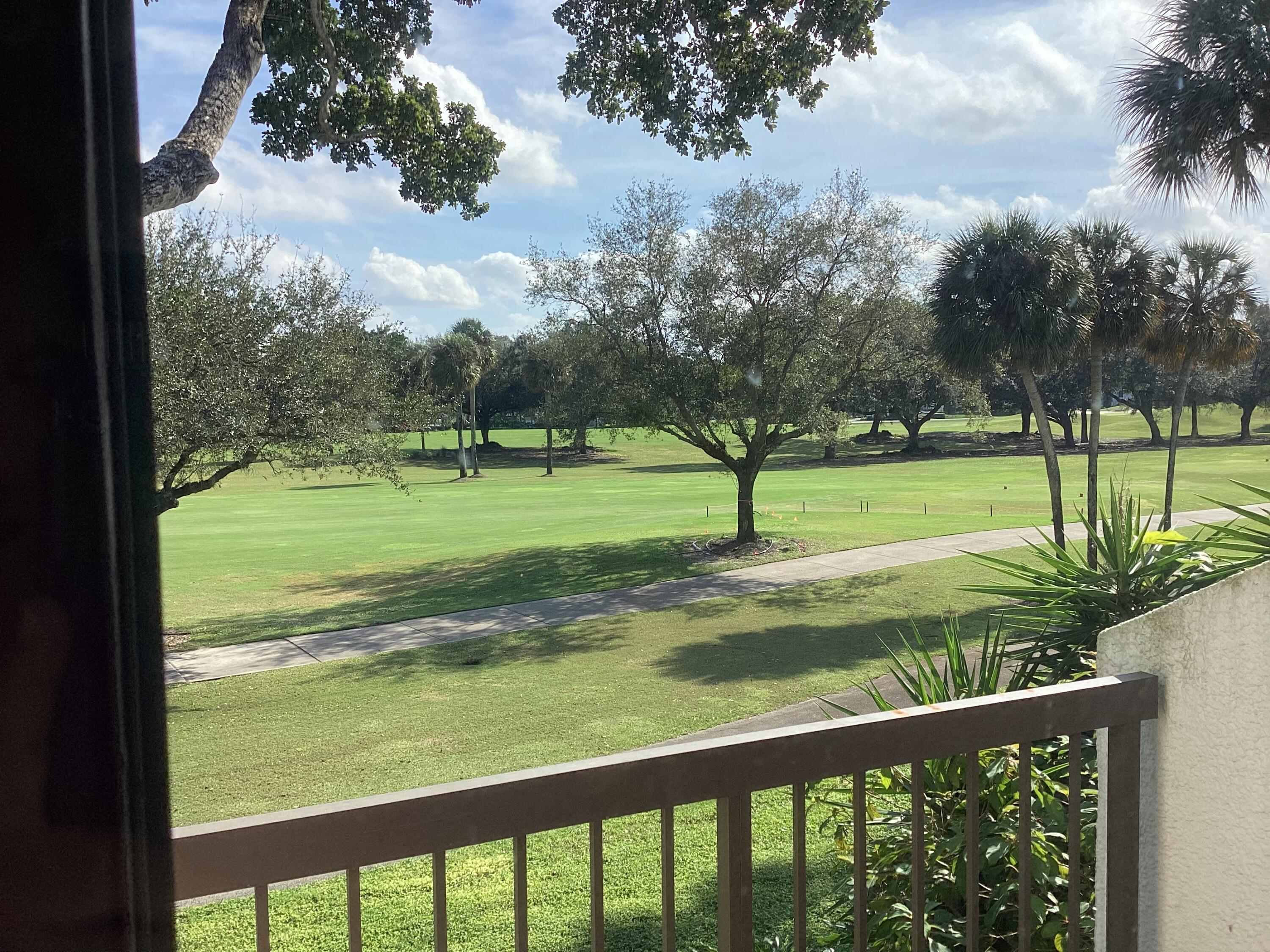 2308 Bridgewood Drive, Unit 2308 Boca Raton, FL 33434 - Photo 9 of 42 a view of swimming pool with a yard