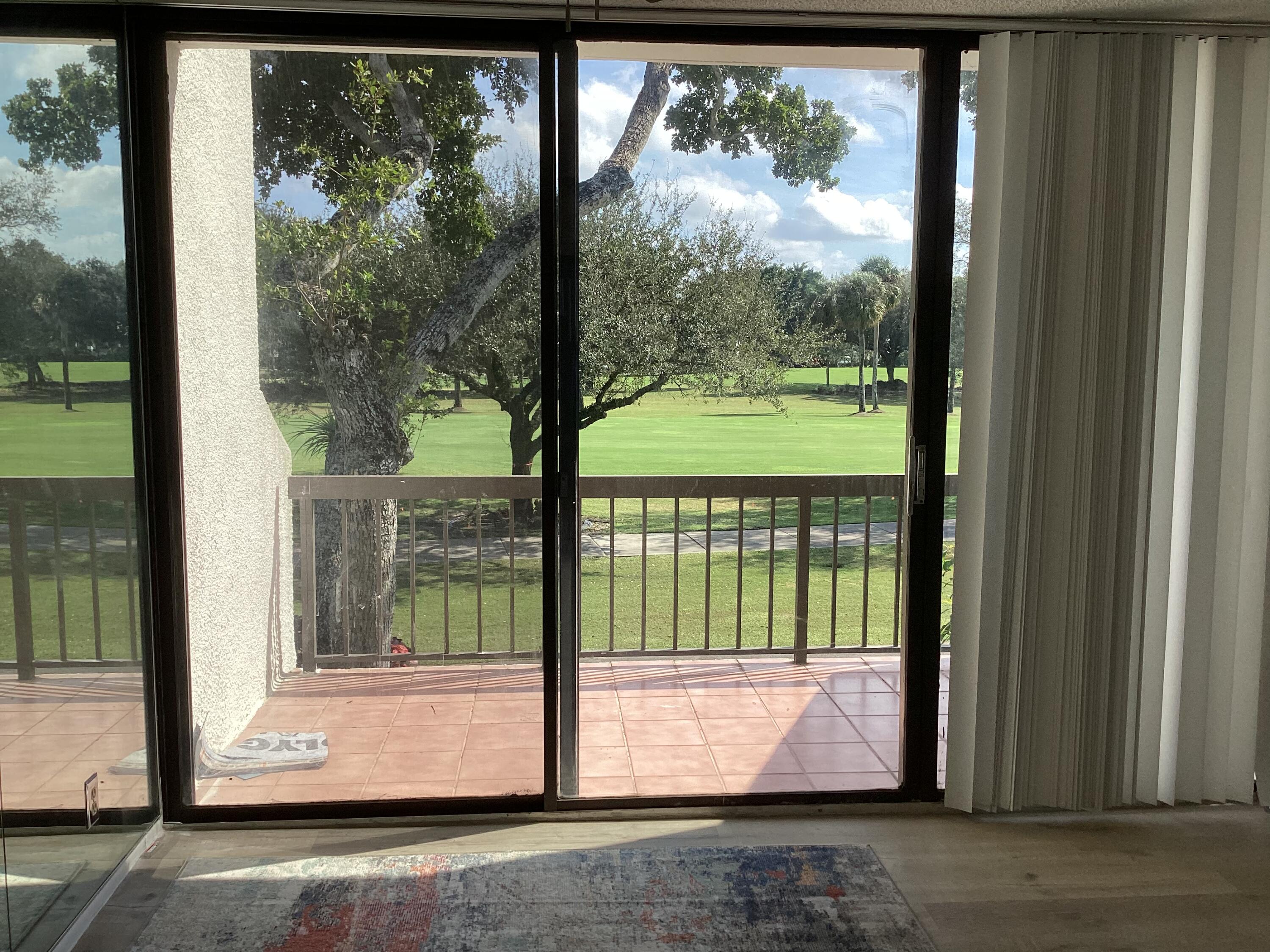 2308 Bridgewood Drive, Unit 2308 Boca Raton, FL 33434 - Photo 10 of 42 a view of a large window with an outdoor space