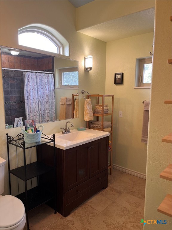 121 Butler Lane Martindale, TX 78655 - Photo 11 of 27 a bathroom with a sink and a mirror