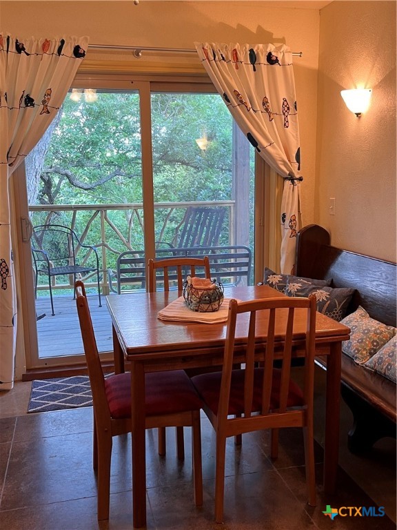 121 Butler Lane Martindale, TX 78655 - Photo 17 of 27 a dining room with furniture and wooden floor