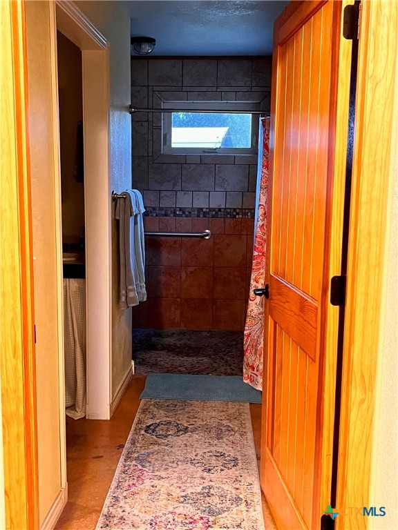 121 Butler Lane Martindale, TX 78655 - Photo 24 of 27 a bathroom with a shower and a sink