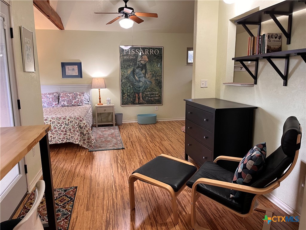 121 Butler Lane Martindale, TX 78655 - Photo 6 of 27 a living room with furniture and a wooden floor